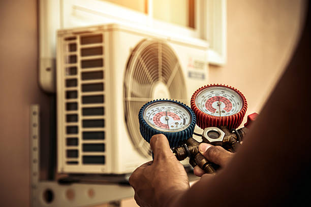 Professional Air Conditioning Service technician working in Holliston, MA